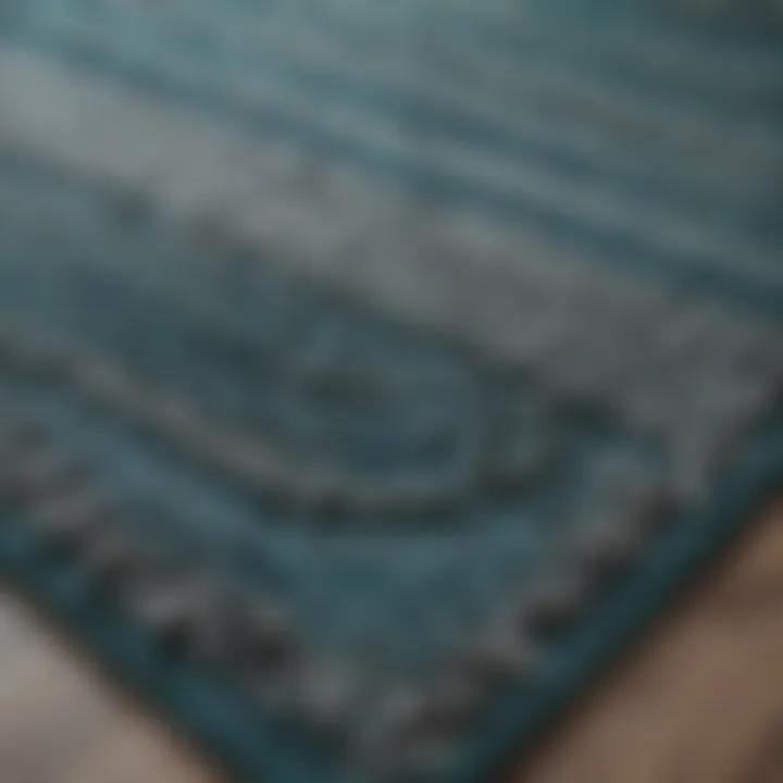 Close-up of a textured teal and gray rug