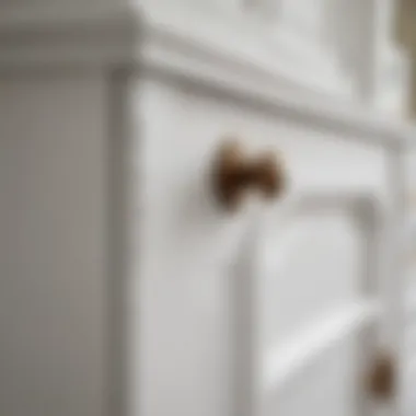 Close-up of fine craftsmanship in a white buffet hutch cabinet, highlighting materials and textures.